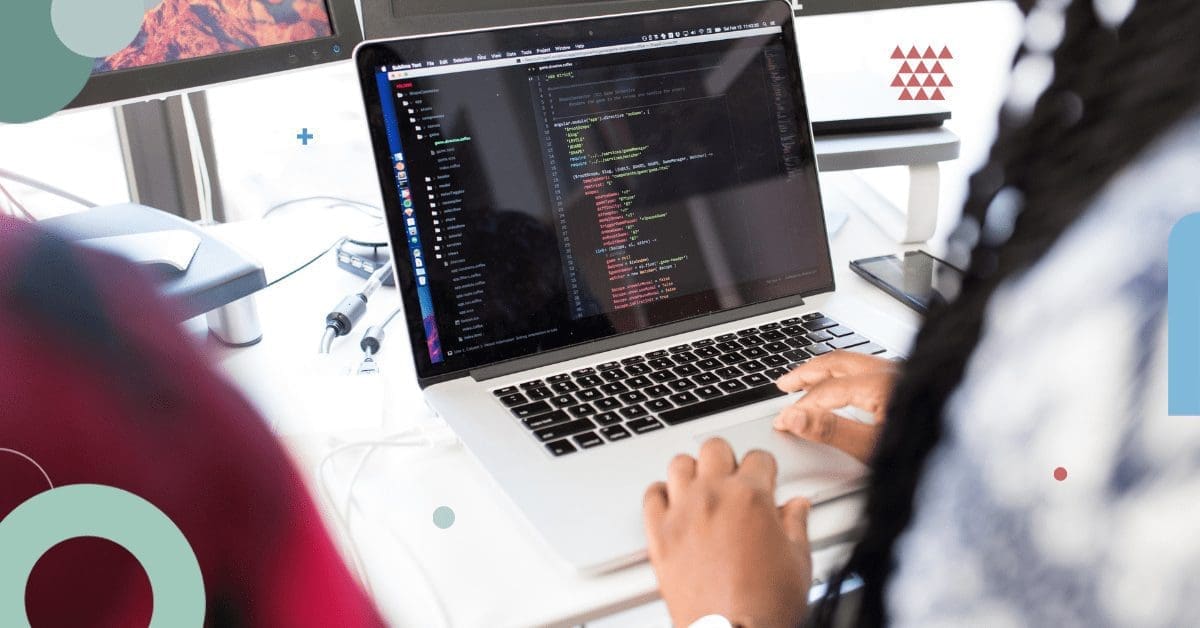 Woman coding on laptop